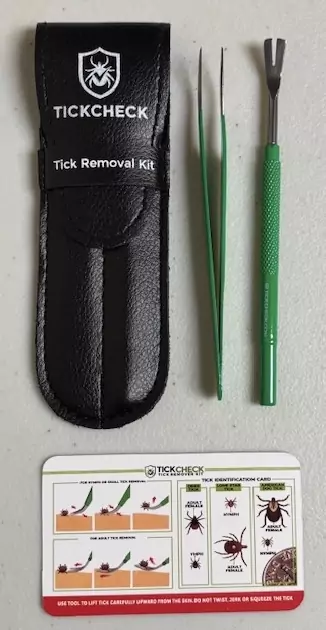 Tick Check Removal Kit with Stainless Steel fine tip tweezers and slotted scoop in leather case.